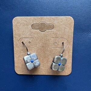 silver flower dangle earrings with blue accent